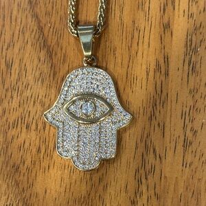 Gold Hamsa Pendant Necklace with Diamond in center of Evil Eye.